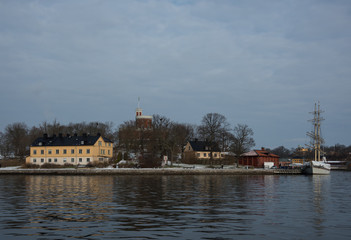 Fototapeta premium Stockholm waterfront a winter day islands in snow an ice
