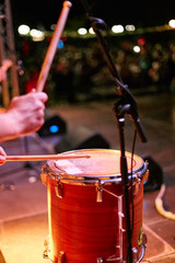 Drummer rehearsing on drums before rock concert