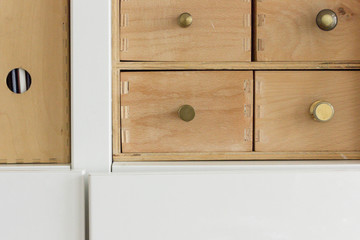 cabinet with drawers on wooden background