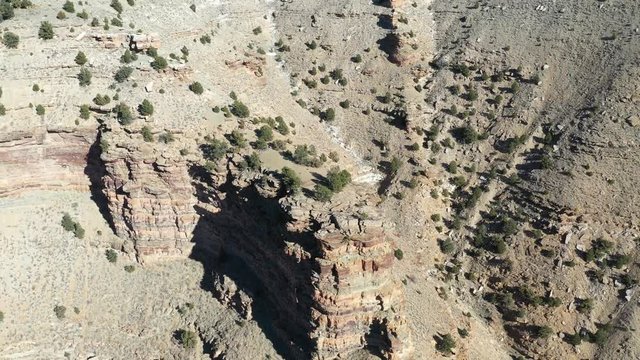 Aerial descent rocky desert mountain Nine Mile Canyon Utah. Nine Mile Canyon, Utah. World&rsquo;s longest art gallery of ancient native American, Indian rock art, hieroglyphs, pictographs and petroglyphs.