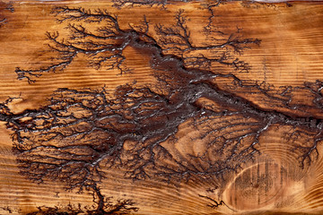 The texture of light wood with dark decorative stripes.