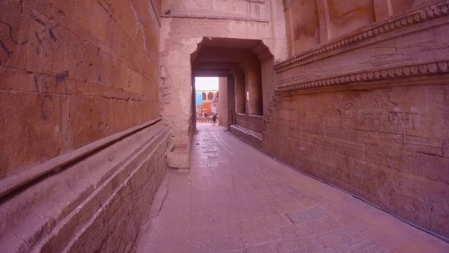 Street of Golden Fort bull walks archway yellow sandstone walls