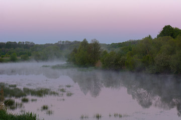 Misty morning over the river in the spring