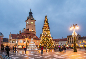 Brasov, Romania - December 11, 2018: Christmas market and decorations tree in center of Brasov...