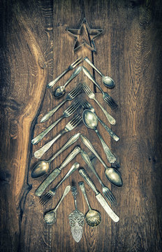 Christmas tree decoration cutlery wooden background vintage