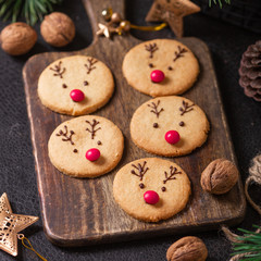 Homemade deer cookies decorated chocolate and red candies Soft focus Greeting card