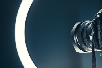 Camera lens and LED ring light in studio