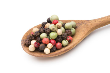 Pepper mix seed on spoon on white background.