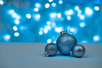 Christmas balls with defocused christmas lights