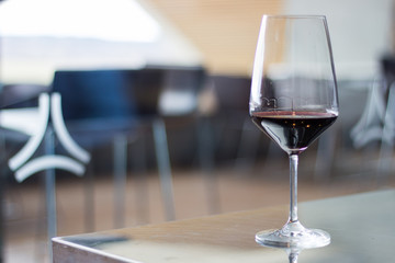 glass of red wine on table