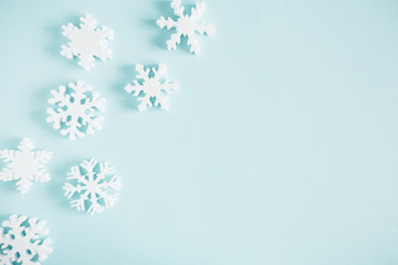 Christmas modern composition. Pattern made of snowflakes on pastel blue background. Christmas, New Year, winter concept. Flat lay, top view, copy space