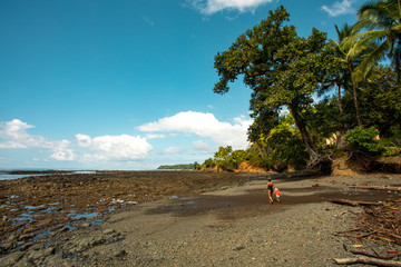 Women and Child walking in the beach