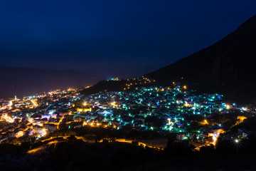 Fototapeta premium beautiful view of chefchaouen at night, from the spanish mosque on the top of the city. long exposure of chefchaouen, Morocco.