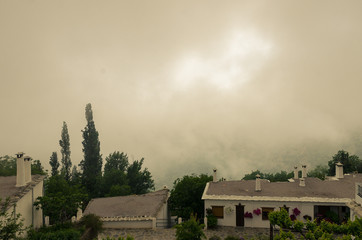 Spain. Streets of Bubion, village of the Alpujarras of Granada in Andalusia, among the fog.