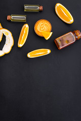 organic cosmetics for homemade spa with orange oil black background top view mockup
