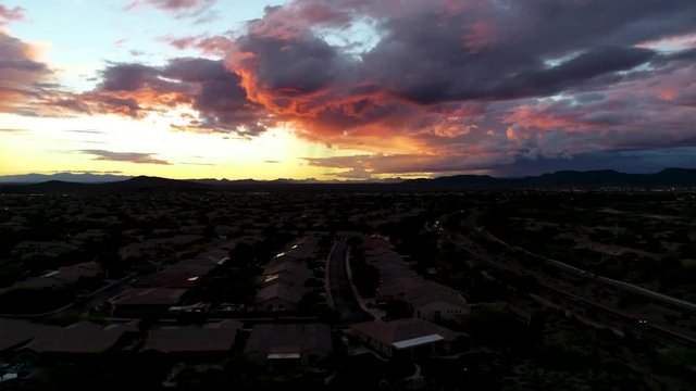 Aerial Rising Reveal Of Arizona Community And Beautiful Sunset