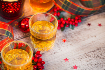 Whiskey, brandy or liquor shot and Christmas decorations