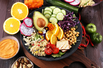 grilled tofu and dragon fruit buddha bowl with vegetable and humus
