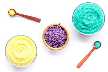 Colorful bath salt on white background top view