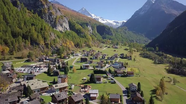 Rural Swiss Alps village with wooden barns