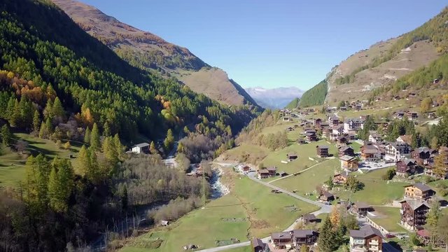 Rural Swiss Alps village with wooden barns