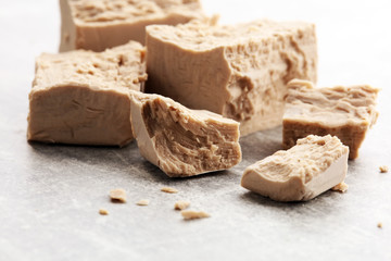 Dry yeast crumbled and yeast block for baking