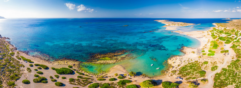 Fototapeta Aerial view of Elafonissi beach on Crete island with azure clear water, Greece, Europeof Elafonissi beach on Crete island with azure clear water, Greece, Europe