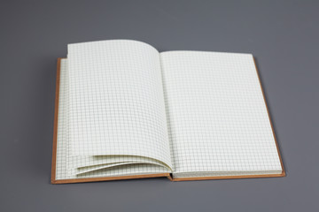 open notebook lies on the desk in the office