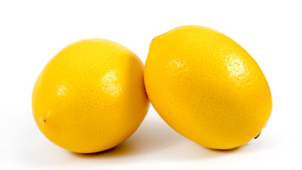 Two ripe lemons. Isolated on white background