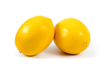Two ripe lemons. Isolated on white background