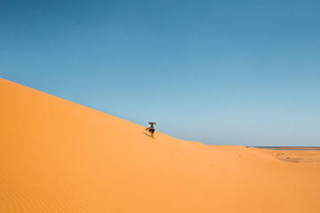 Man walking in the desert © Trevor