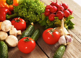 Composition with assorted raw organic vegetables wooden table