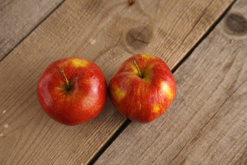wooden plate with ripe fresh red and green apples
