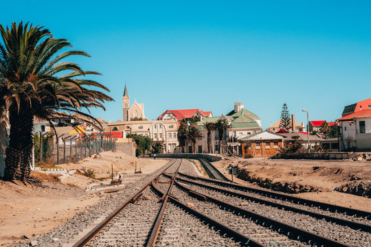 Train tracks leading to a town