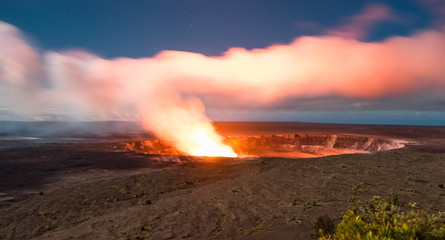 Fire and smoke rise from a volcano 