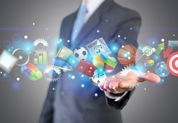 Man holding business elements icons on screen