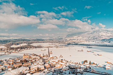 Fototapeta premium Gruyeres town village and Alps mountains in Switzerland winter