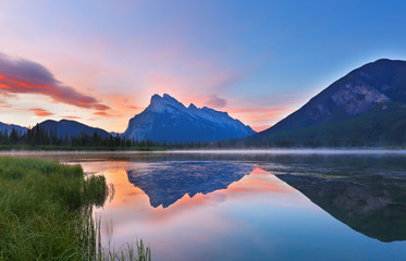 Fototapeta premium Beautiful sunrise over Vermillion Lake , Banff National Park, Alberta, Canada. Vermilion Lakes are a series of lakes located immediately west of Banff, Alberta