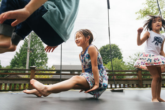 Children jumping on a trampoline