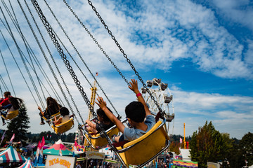Children on a merry go round ride