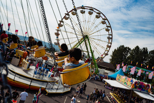 Young boy on an merry go round ride