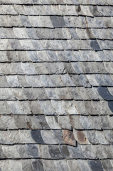 grey slate shingles at the grey wall