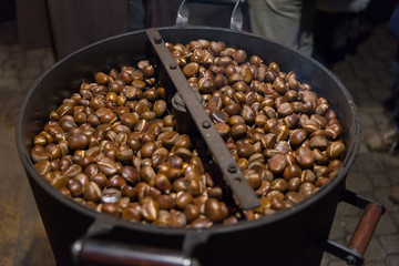 Traditionally roasted chestnuts on wood stove