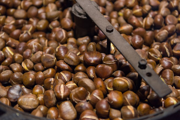 Traditionally roasted chestnuts on wood stove