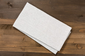 White tablecloth isolated on wooden background