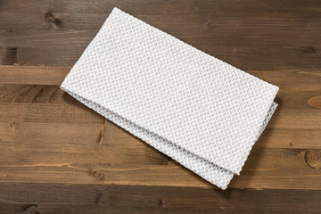 White tablecloth isolated on wooden background