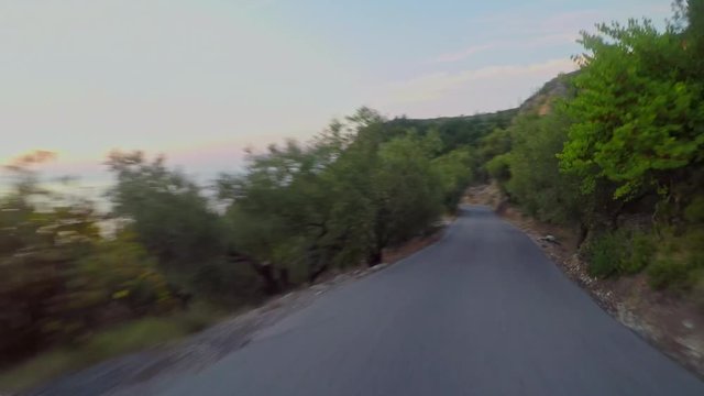 Driving car sunset island rustic road
