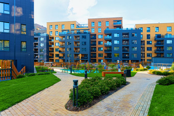 Modern new residential apartment house building complex outdoor facilities bench