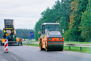 Road roller on highway road in Poland