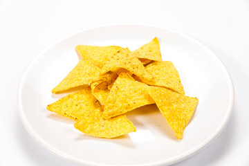 Crispy nachos on a plate isolated on white background